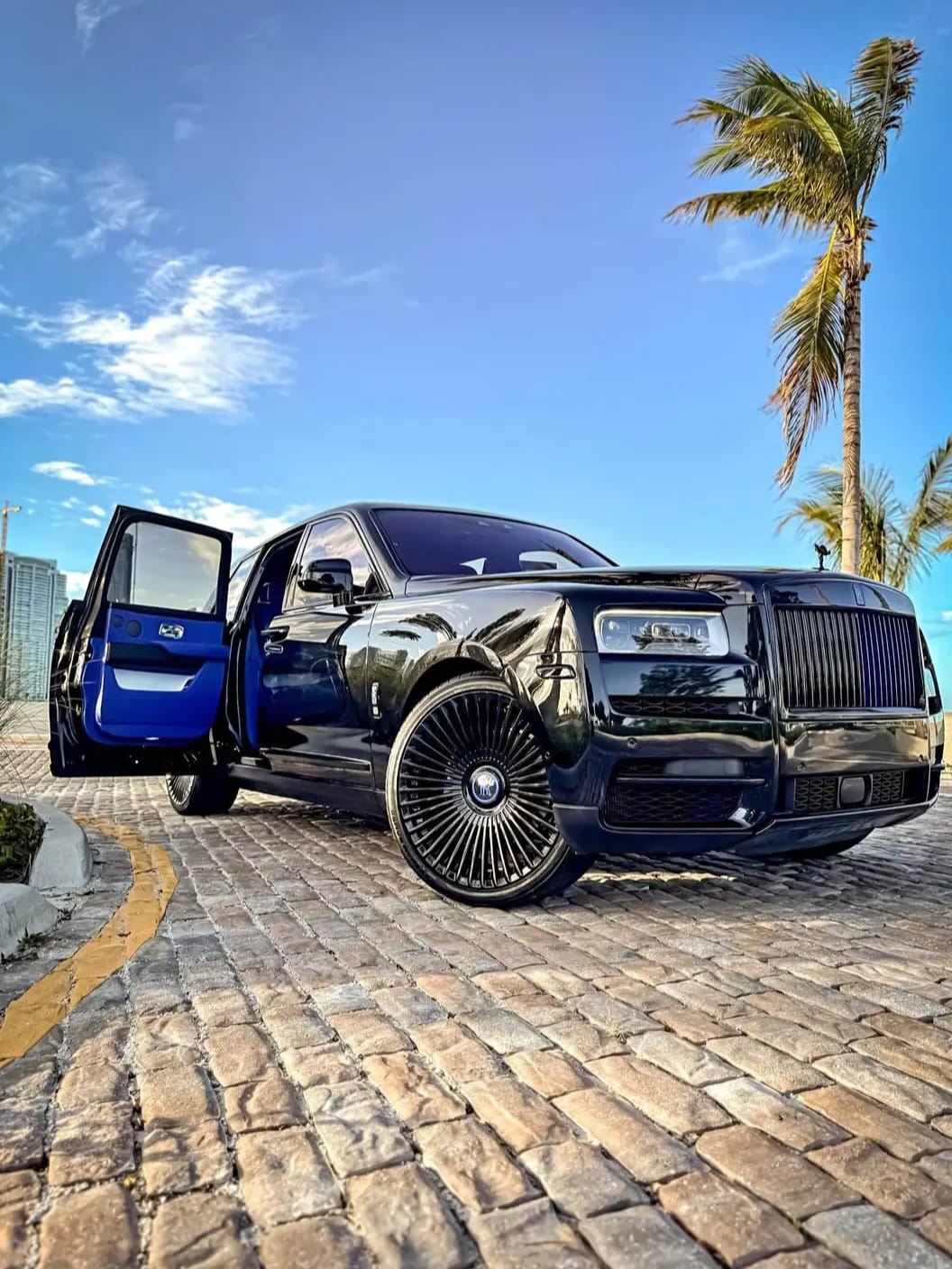Cullinan side profile with coach doors open at sunset