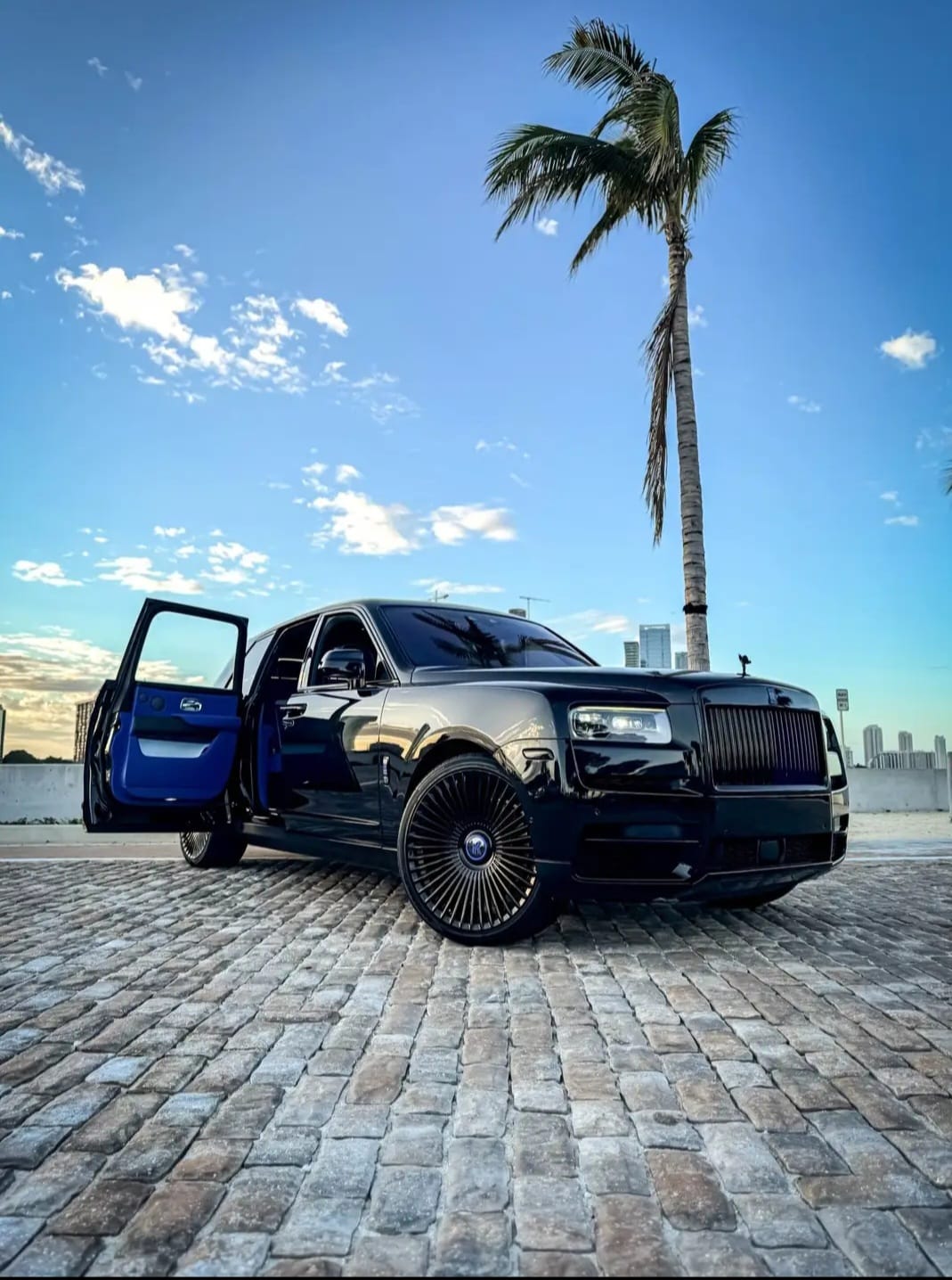 Cullinan with coach door open showing blue interior